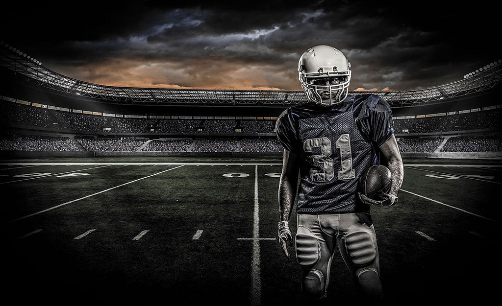 Флізелінові фотошпалери футбол 312x219 см Футболіст на полі для регбі (1115VEXXL)+клей